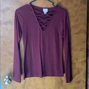long sleeve crossed open chest shirt.